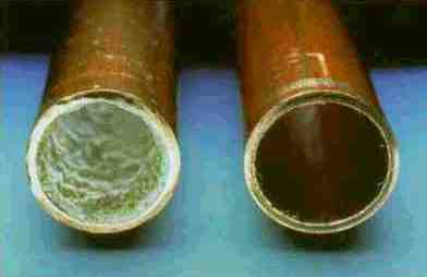 2 pipes, the left one is lined with white scale, the right one is clean.